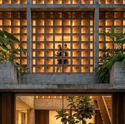 The lattice facade lit from within at night