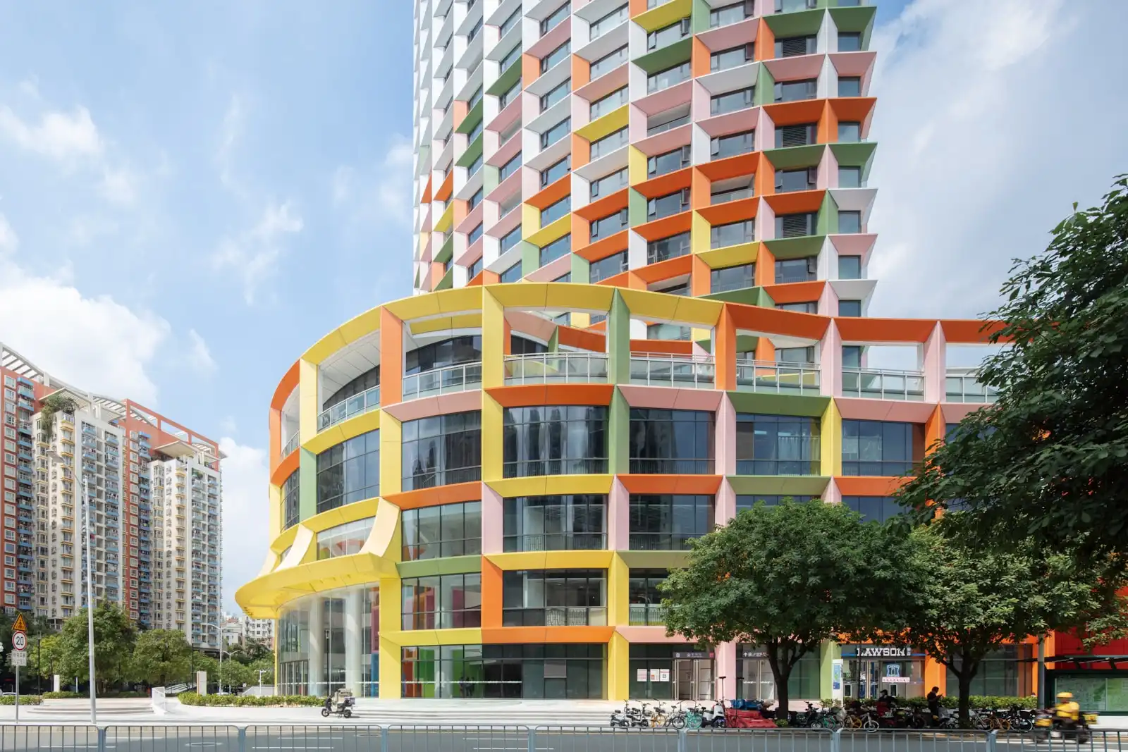 Exterior view with colourful shading frames and repurposed public plaza © Ossip van Duivenbode, MVRDV